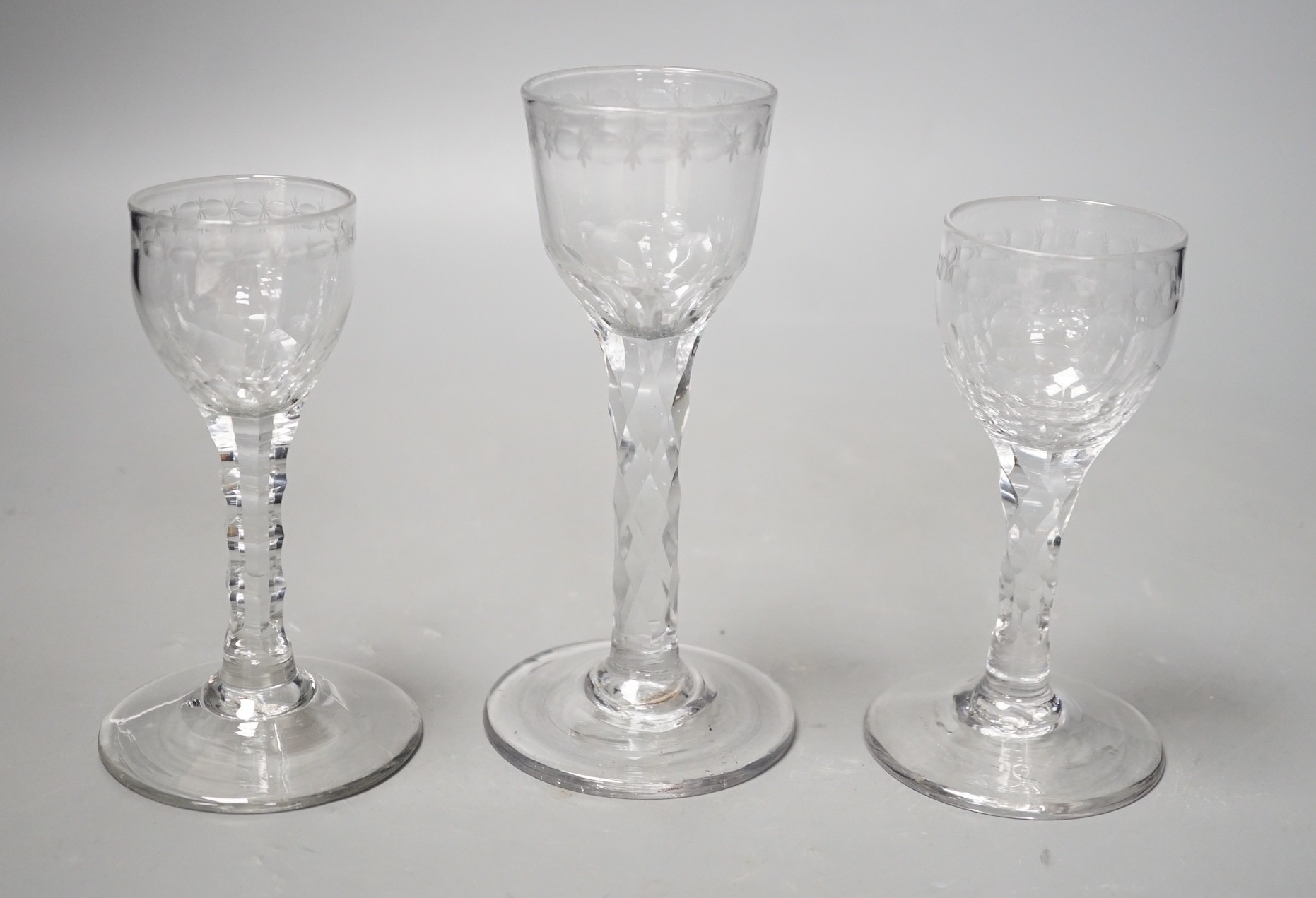 Three George III facet stem ‘OXO’ drinking glasses, tallest 15cms high